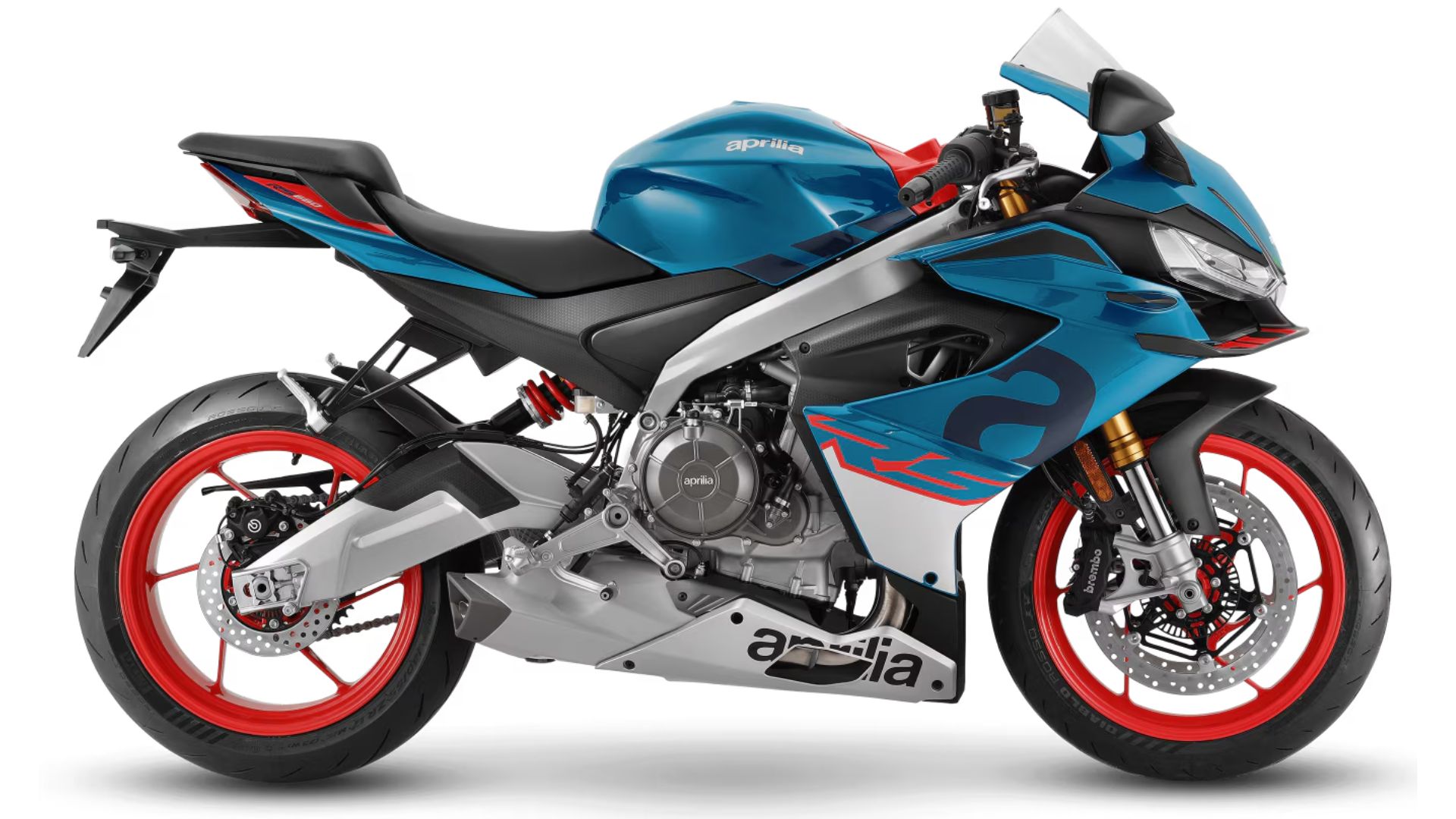 Motocikl Aprilia RS 660 u plavoj boji s crvenim naplatcima, snimljen u kompletnom bočnom profilu na bijeloj pozadini.