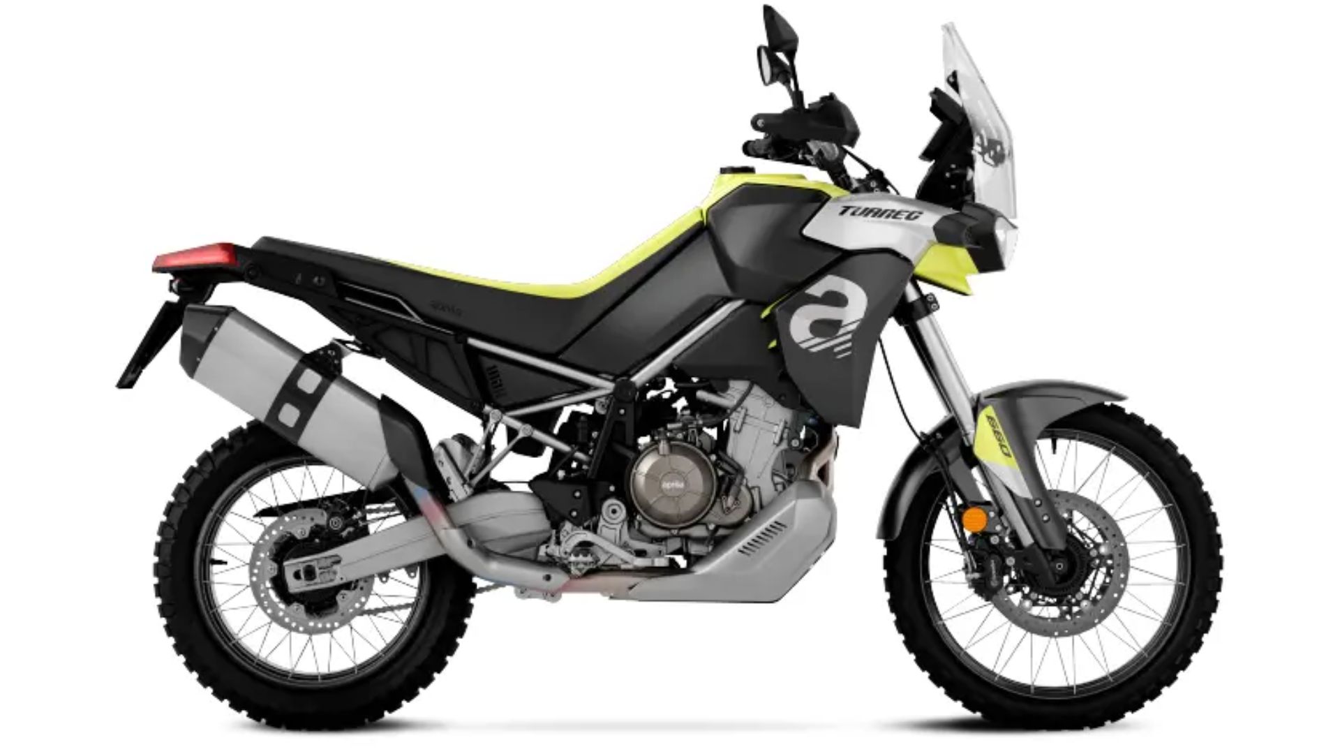 Bočni pogled na motocikel Aprilia Tuareg 660 v sivo-črni barvni kombinaciji z rumenimi poudarki, prikazan v profilu s terenskimi pnevmatikami, visokim blatnikom in vetrobranom za zaščito med vožnjo po zahtevnem terenu.